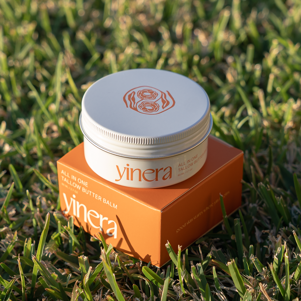 Yinera tallow butter balm | skincare photography on grass
